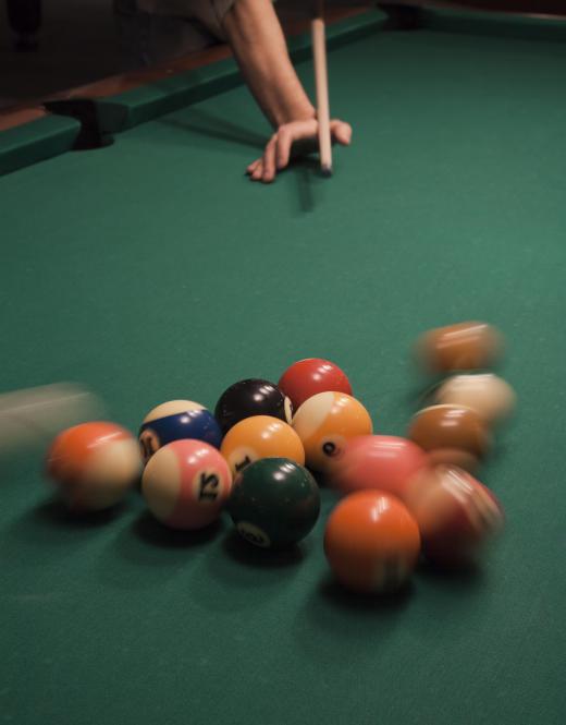 The collison of billiard balls shows elastic scattering.