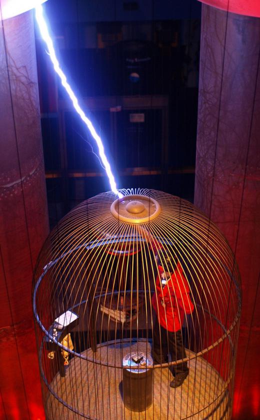 Faraday cage with bolt of electricity.
