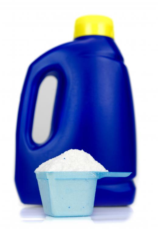 A bottle and cup of laundry detergent.