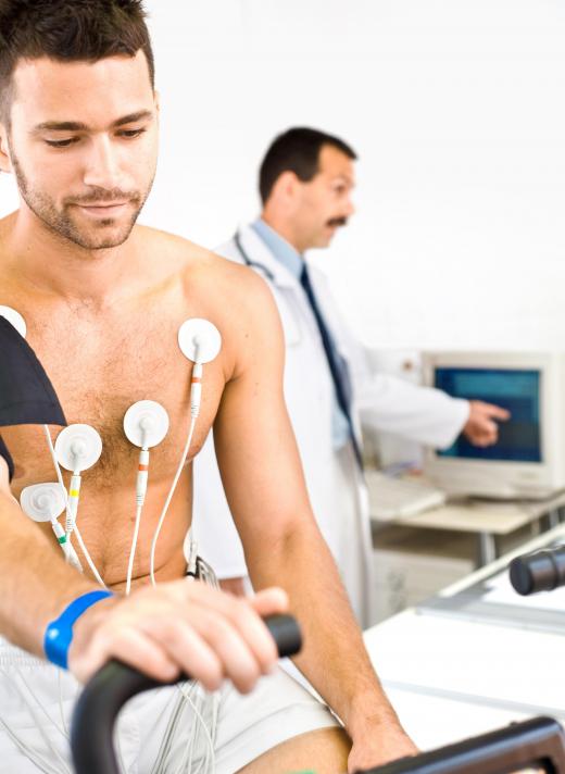 Man getting an EKG. In an EKG, electrodes are placed on the skin to detect the heart's electrical activity.