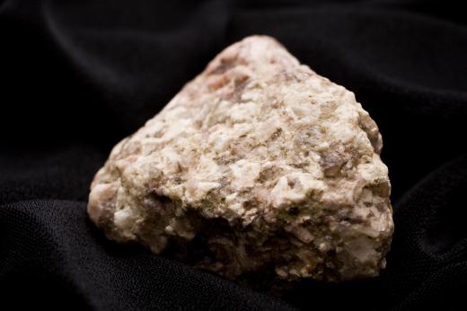 Geologists analyze rock samples to determine mineral properties.