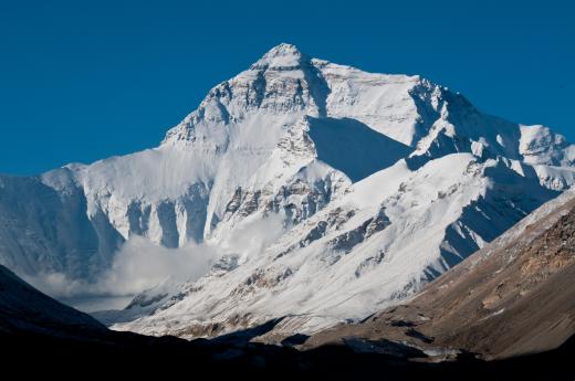 Mountains, such as Mt. Everest, are created when tectonic plates push against each other.