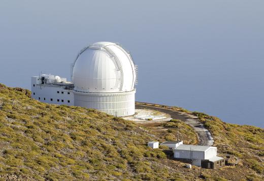 To both escape interference from city lights and provide a wider arc of the sky that can be viewed, observatories are often located on mountains.