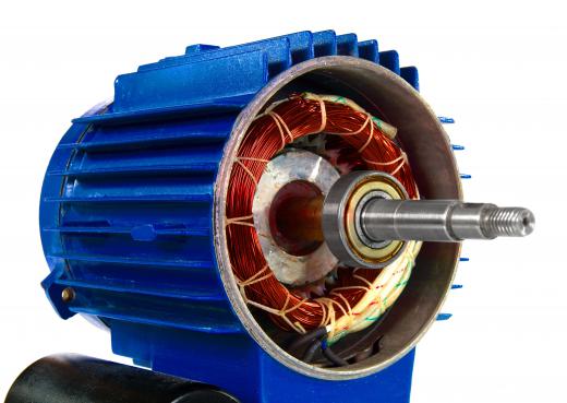 In an electric motor, the application of electricity to a magnet causes it to rotate within a metal housing.