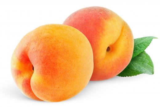 Fruit, like peaches, are studied by pomologists.