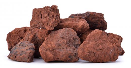 In its natural form, iron ore has a reddish hue and is mixed with various silicates.