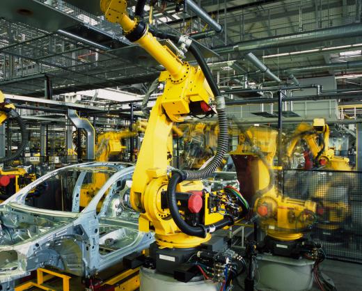 Robots working on an automobile assembly line.