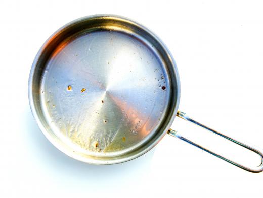 A metal pan on a stove conducts heat.