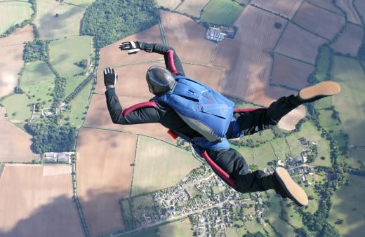 Skydivers increase air resistance by spreading out their bodies.