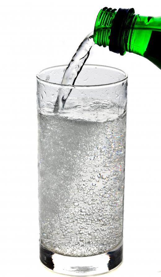 Soda being poured into a glass.