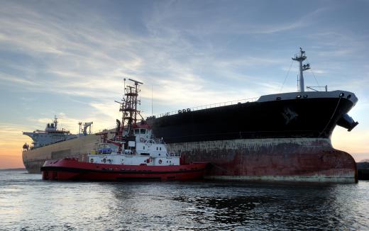 Because modern oil tankers are among the largest ships ever built, they need assistance from tugboats to maneuver in narrow waters.