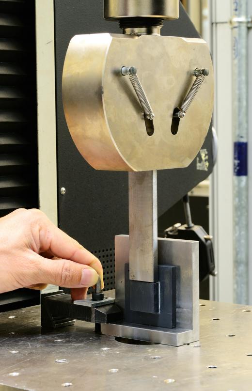 Tensile tests use pulling forces, usually administered by a machine that has been specially calibrated, to test a material's strength.
