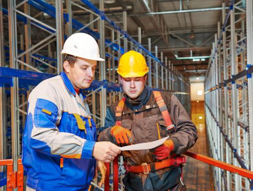 A safety specialist may work closely with a construction project manager to ensure a new facility meets proper design factors and is equipped adequately to handle emergencies.
