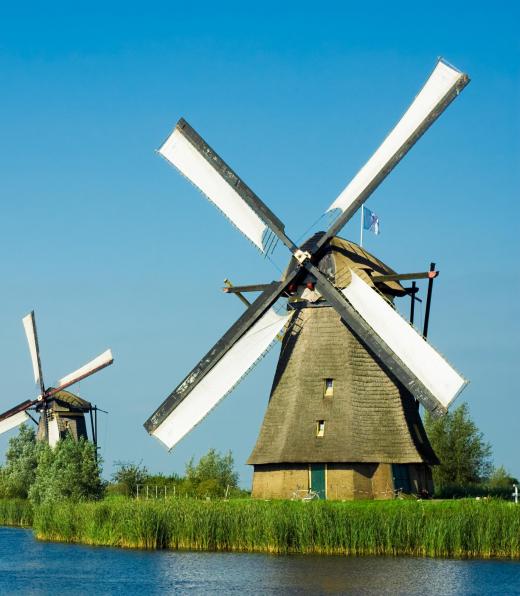 Windmills provided mechanical energy to farms and workshops before the development of internal combustion engines and electrical motors.