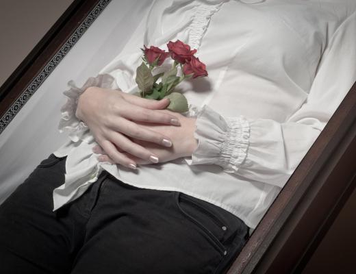 An embalmer is responsible for dressing the deceased for wake and funeral services.