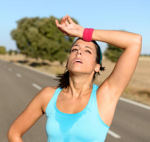 People start to sweat when they exercise because of exercise-induced thermogenesis.